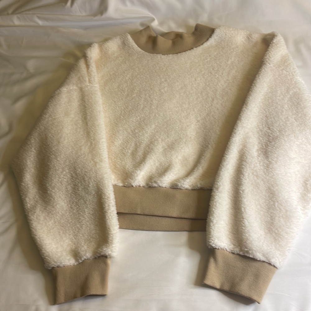 Cream Colored Slightly Cropped Polar Fleece pullover with leggings or jeans.